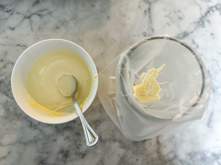 Melted white chocolate for decorating watermelon lollipops