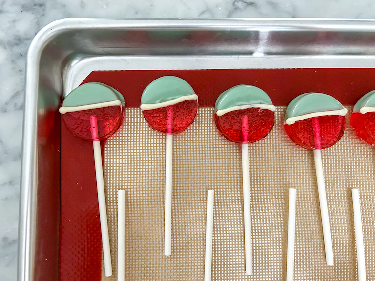 Watermelon lollipops arranged on a tray