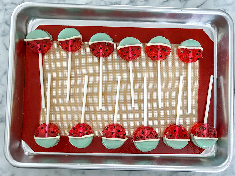 A tray of watermelon lollipops