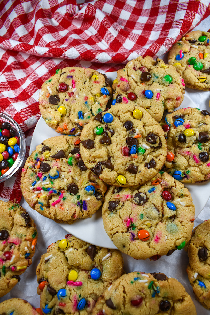 a plate of rainbow M&M peanut butter cookies