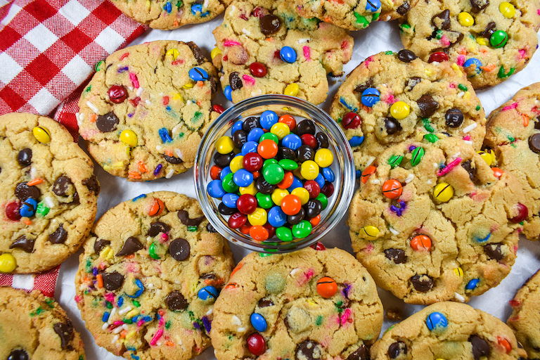 Bowl of mini M&Ms surrounded by M&M cookies