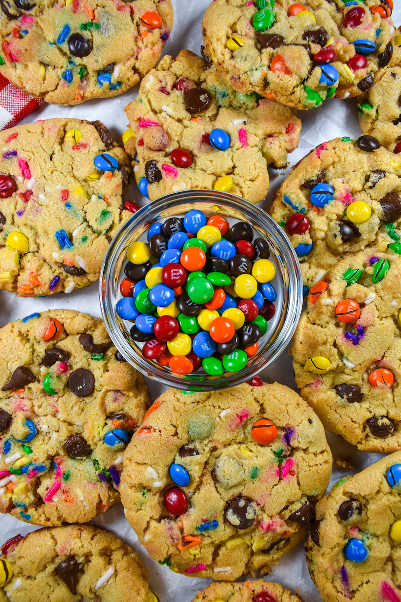 Bowl of M&Ms surrounded by homemade cookies