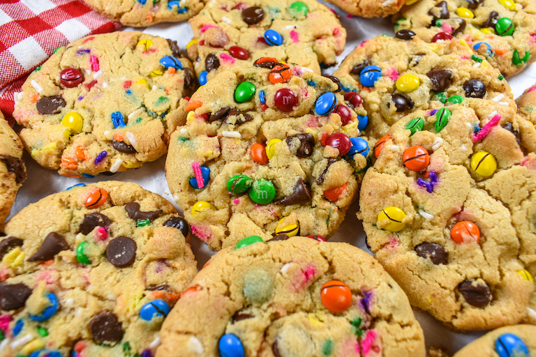 Rainbow cookies on a white surface