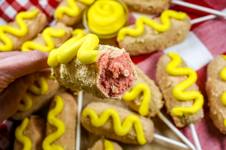 Corn dog pop with a pink cake center