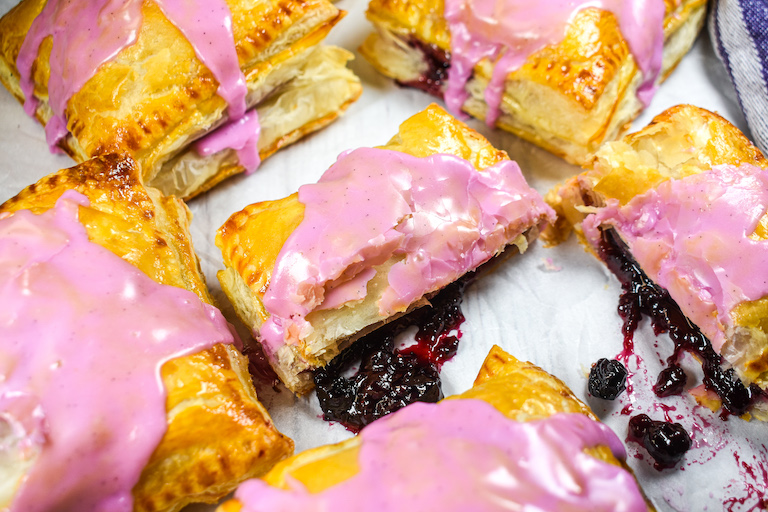 Jam oozing from berry hand pies