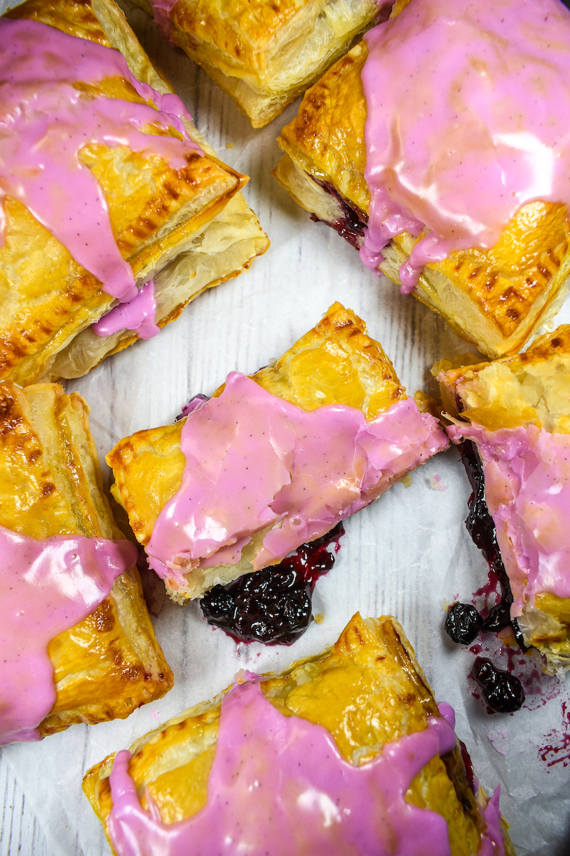 Jam oozing from puff pastry hand pies