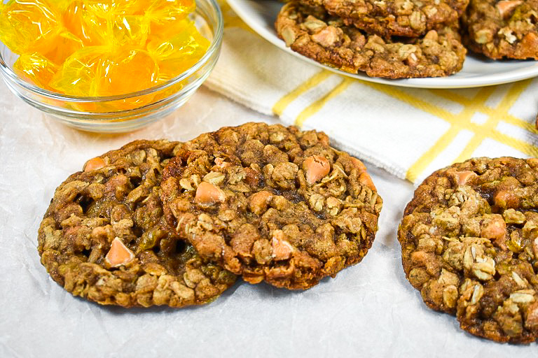 Butterscotch chip cookies on a white surface