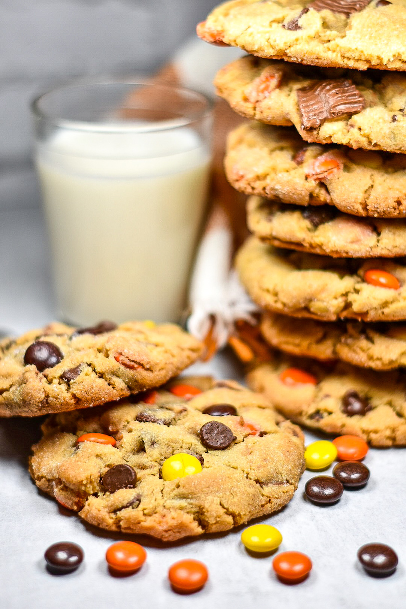 A stack of peanut butter cookies and a glass of milk