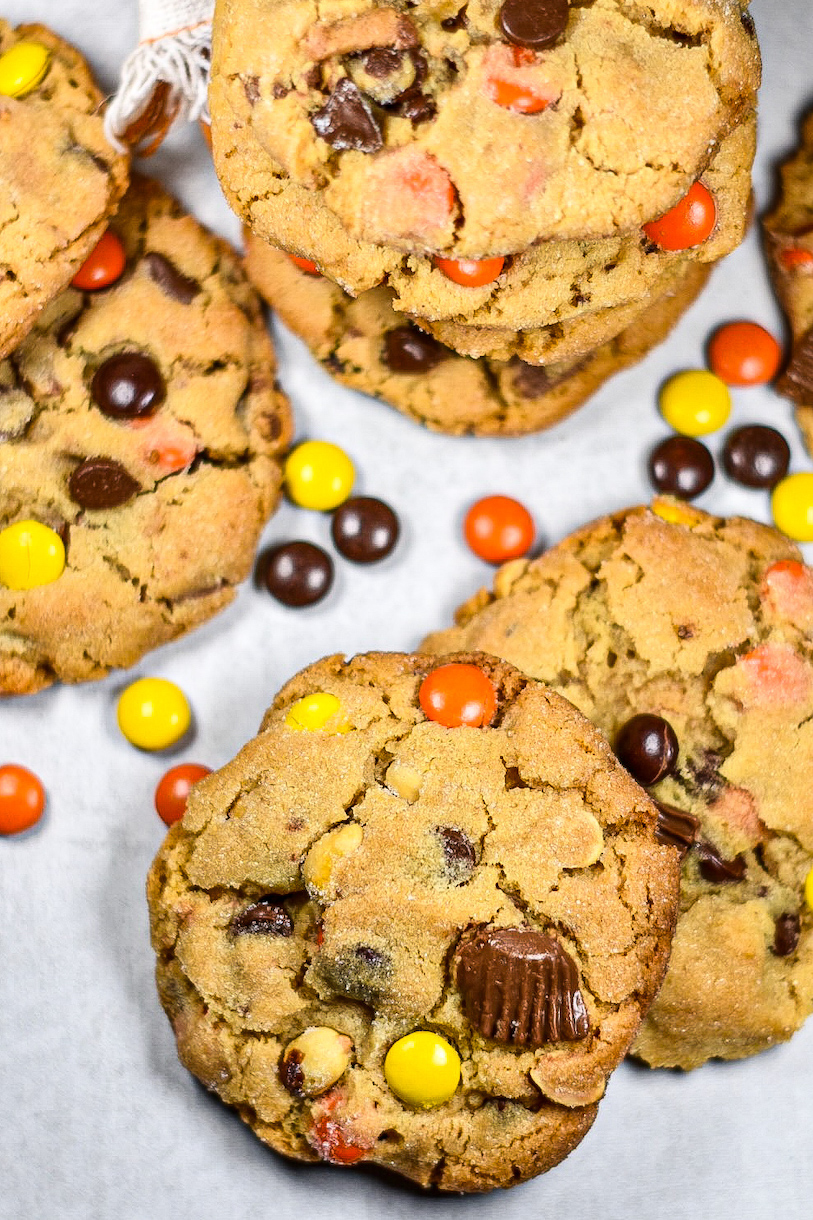 peanut butter cookies and candies on a white surface