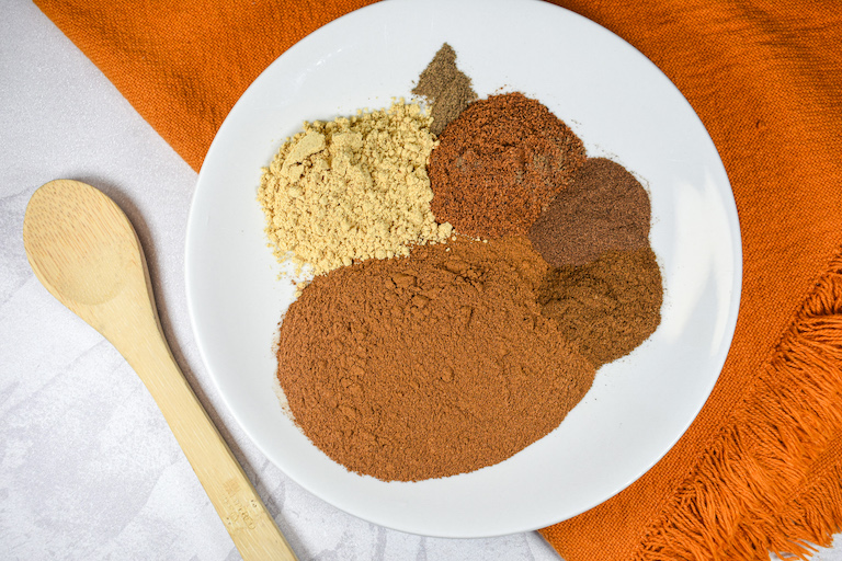 ingredients for pumpkin spice arranged on a plate