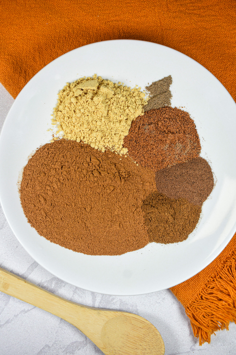 ground spices on a white plate