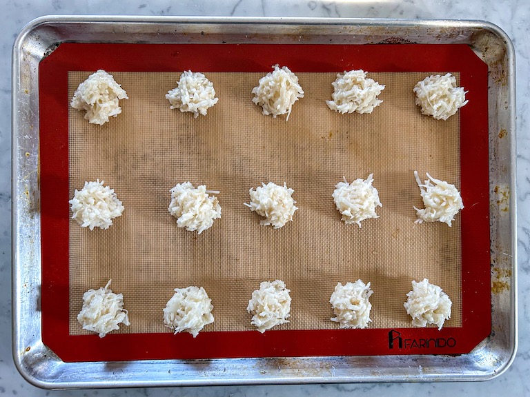 Coconut macaroon batter dropped onto a tray