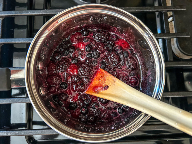 homemade jam in a saucepan with a spoon 