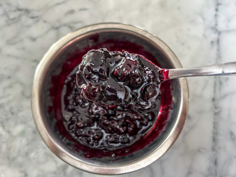 spoon of mixed berry jam