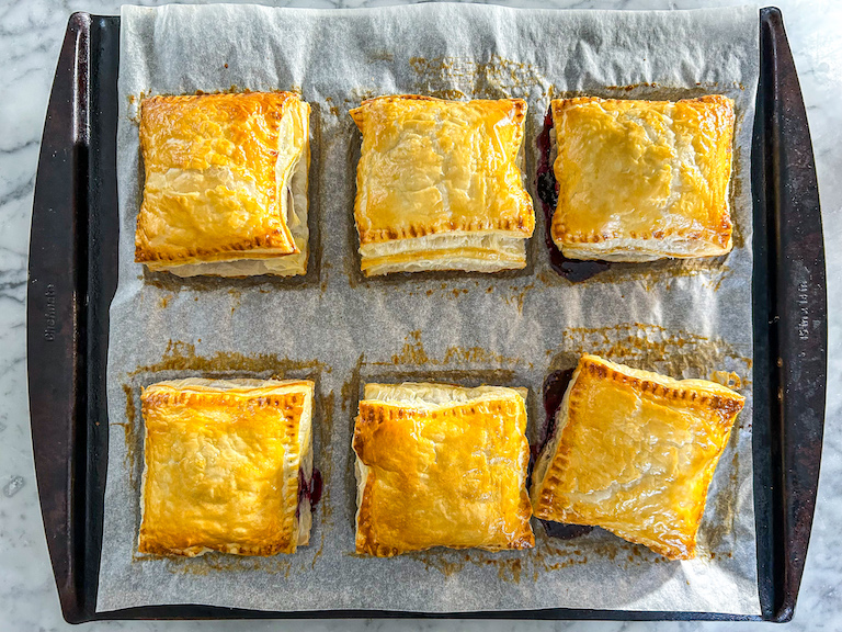 Puff pastry hand pies on a tray