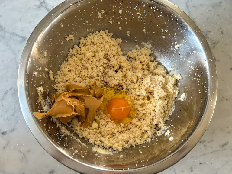 Adding peanut butter and egg to cookie dough