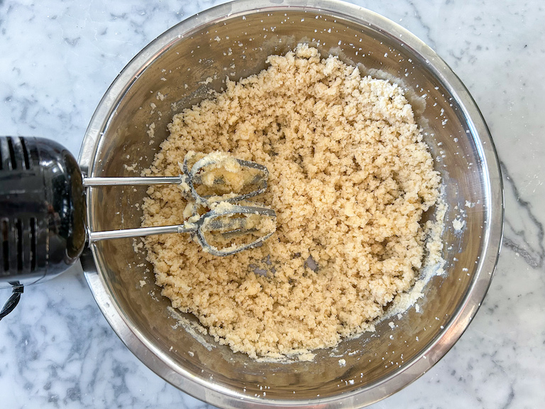 Butter and sugars in a mixing bowl