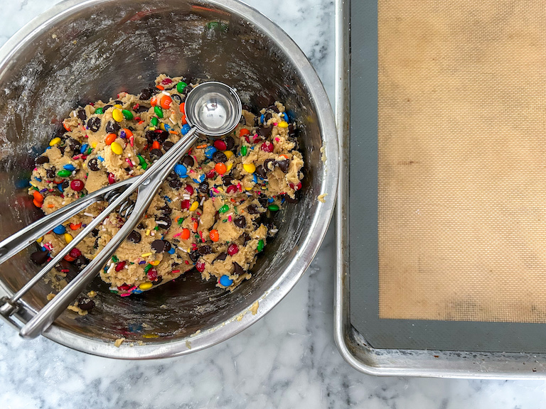 Bowl of cookie dough with a cookie scoop