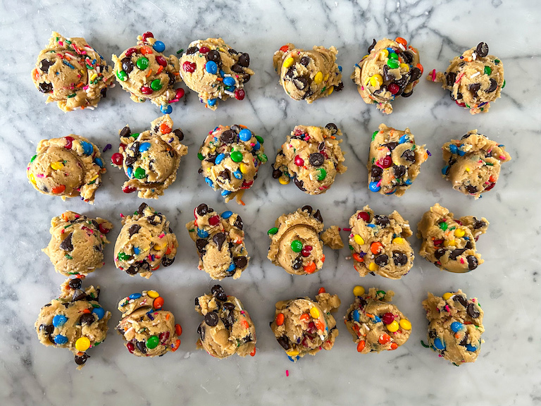 Scoops of cookie dough on a marble surface