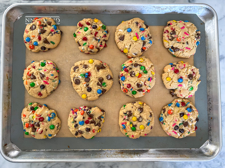 Rainbow M&M cookies on a tray