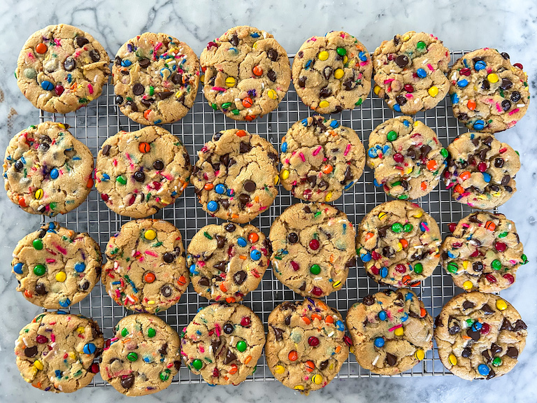 Cookies with M&Ms arranged on a wire rack