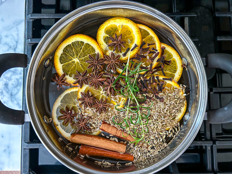 Star anise and orange simmer pot on a stovetop