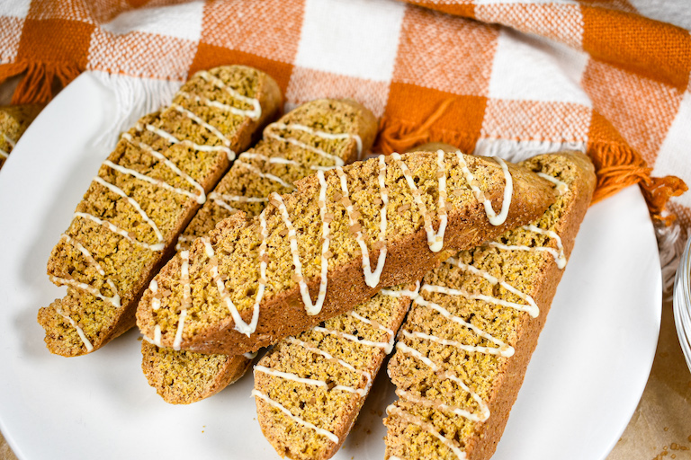 Pumpkin spice biscotti arranged on a white plate