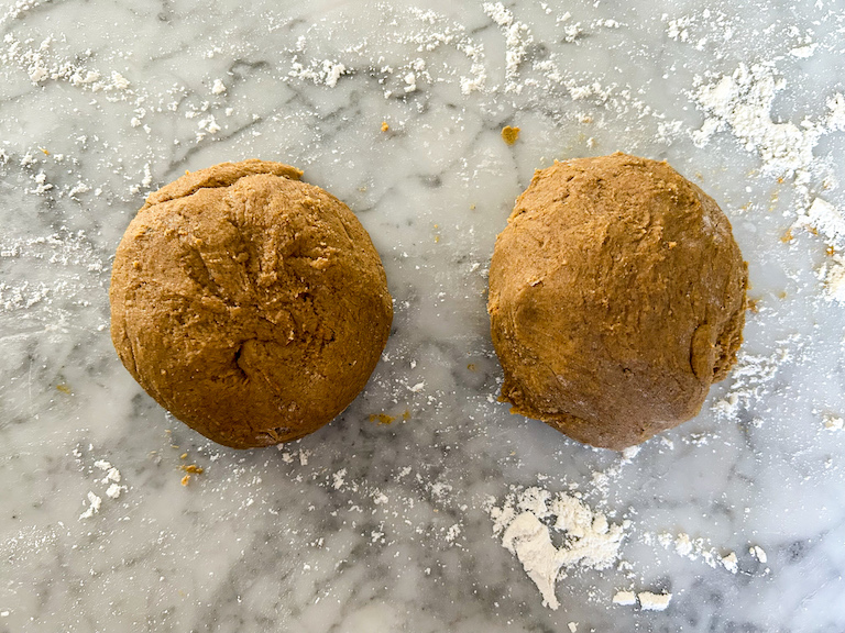 Two balls of pumpkin biscotti dough