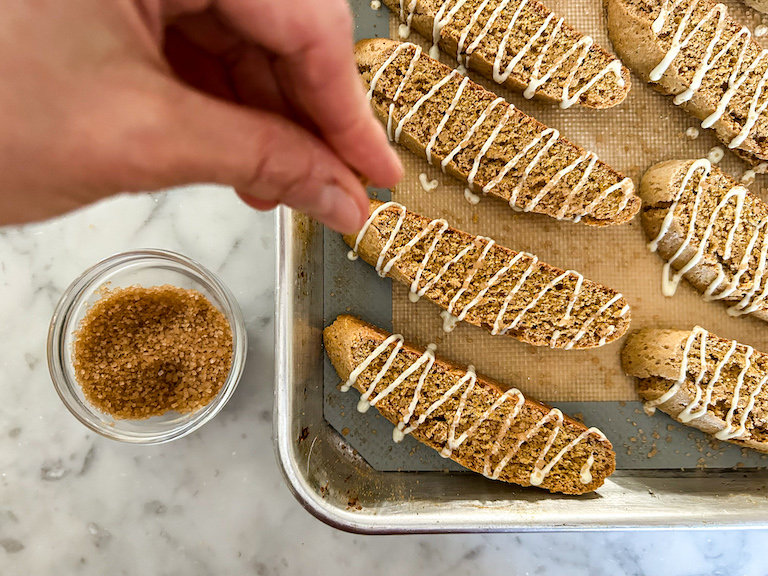 Sprinkling pumpkin biscotti with Demerara sugar