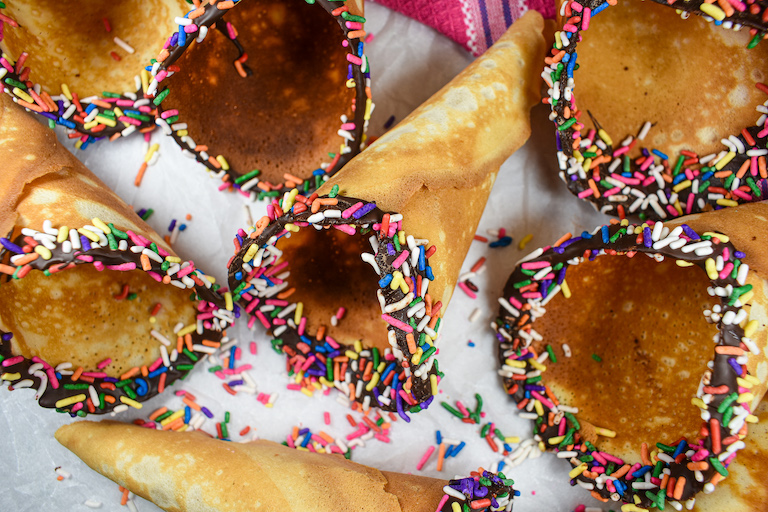 Homemade ice cream cones on a white surface