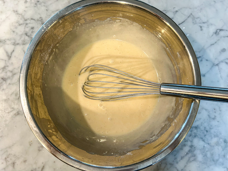 Ice cream cone batter in bowl with whisk