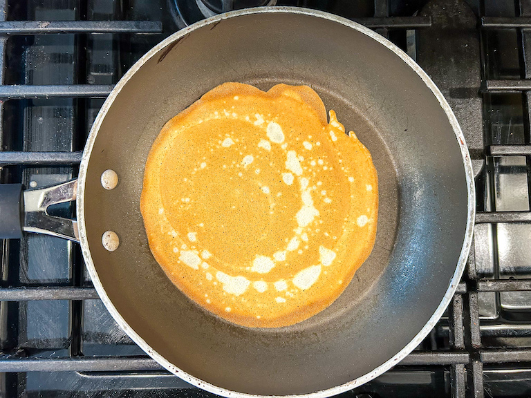Golden brown ice cream cone batter in frying pan