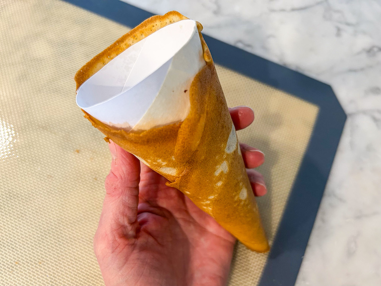 Hand holding a homemade icecream cone