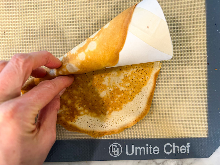 Hand rolling a homemade ice cream cone