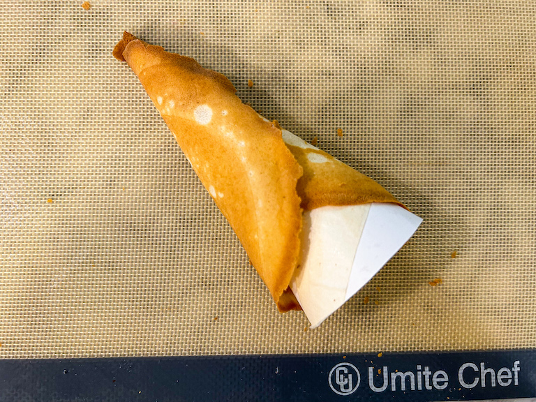 Homemade ice cream cone wrapped around a template