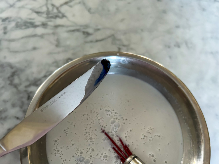 Knife with purple food coloring