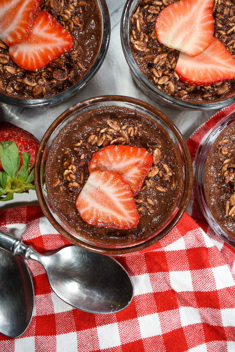 dishes of chocolate overnight oats garnished with fresh berries