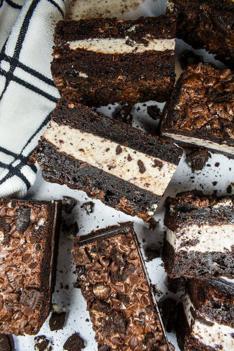 brownie ice cream sandwiches arranged on a white surface
