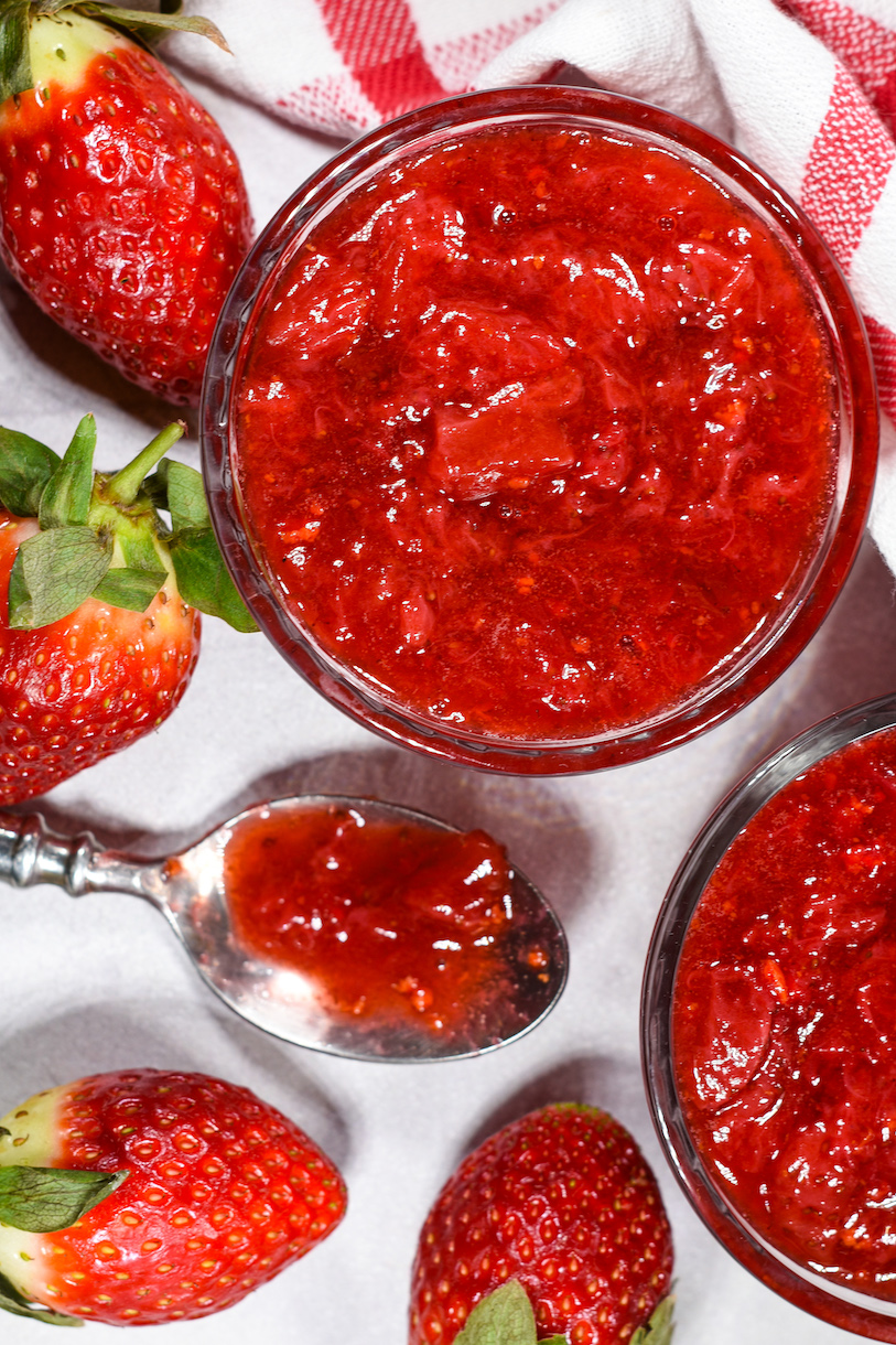 dishes of strawberry compote and fresh berries