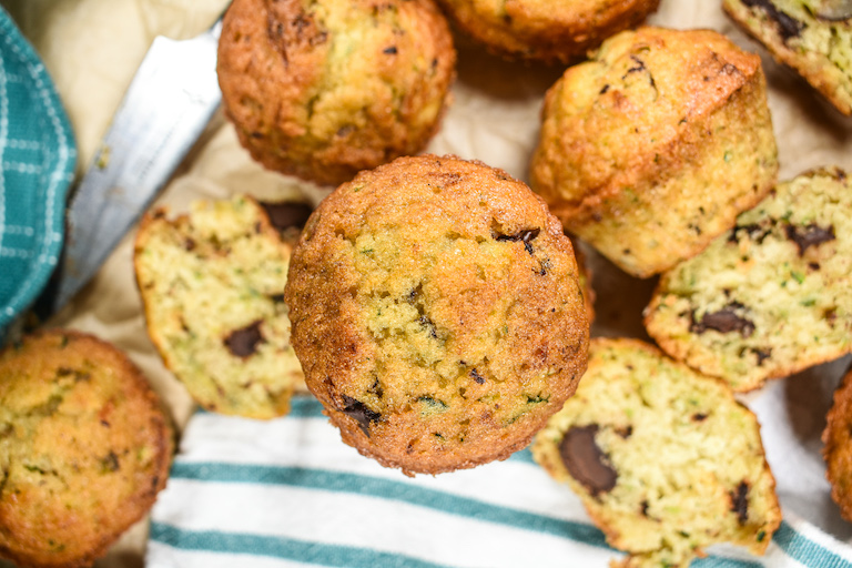 Zucchini muffins on a sheet of parchment