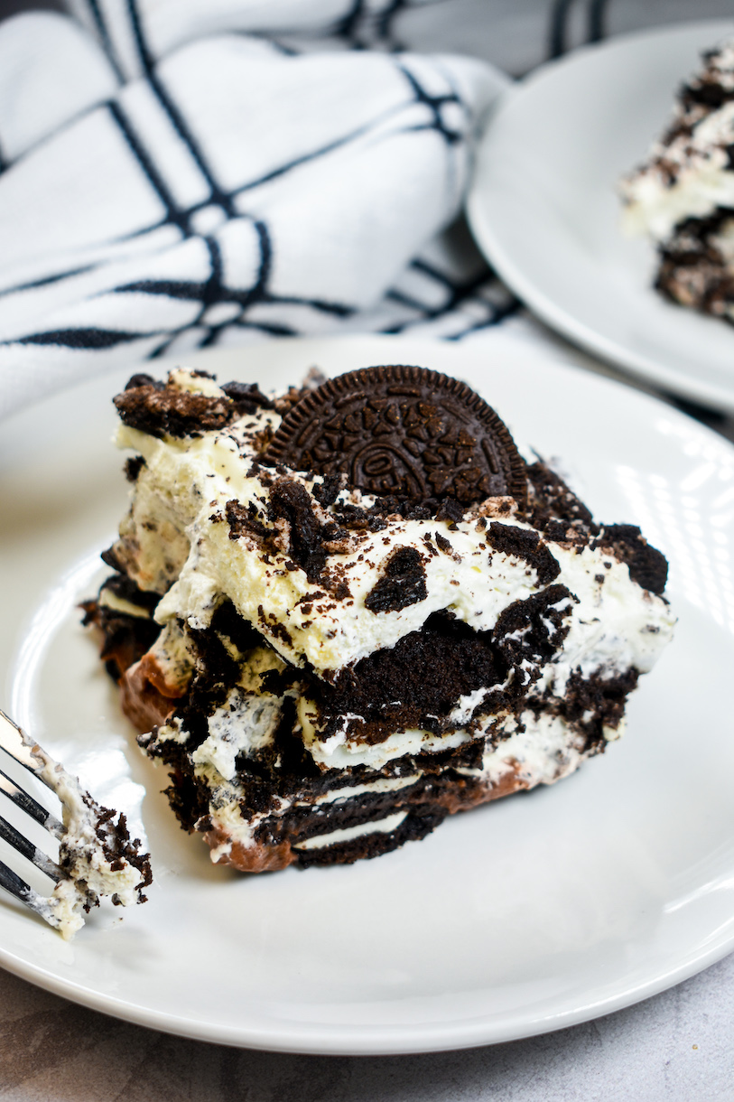 a slice of oreo icebox cake on a white plate