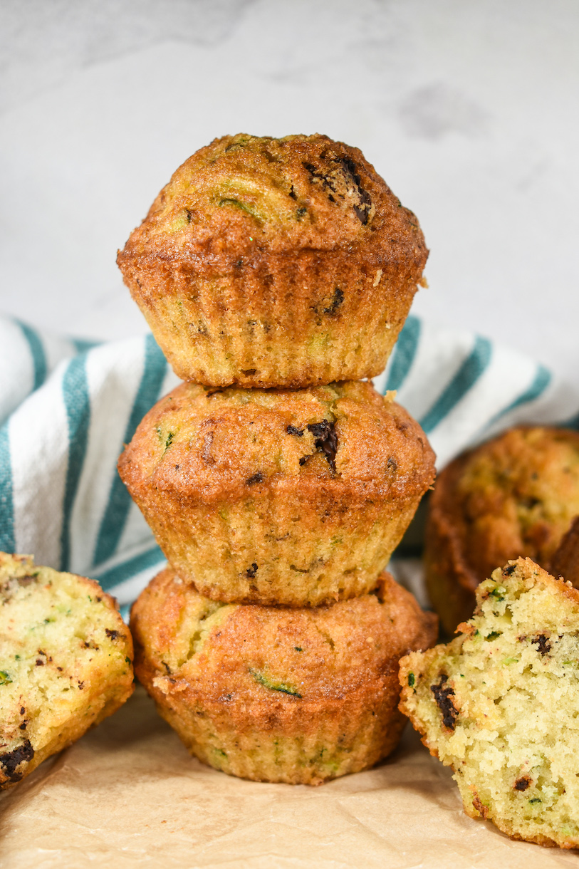 A stack of three chocolate chip zucchini muffins