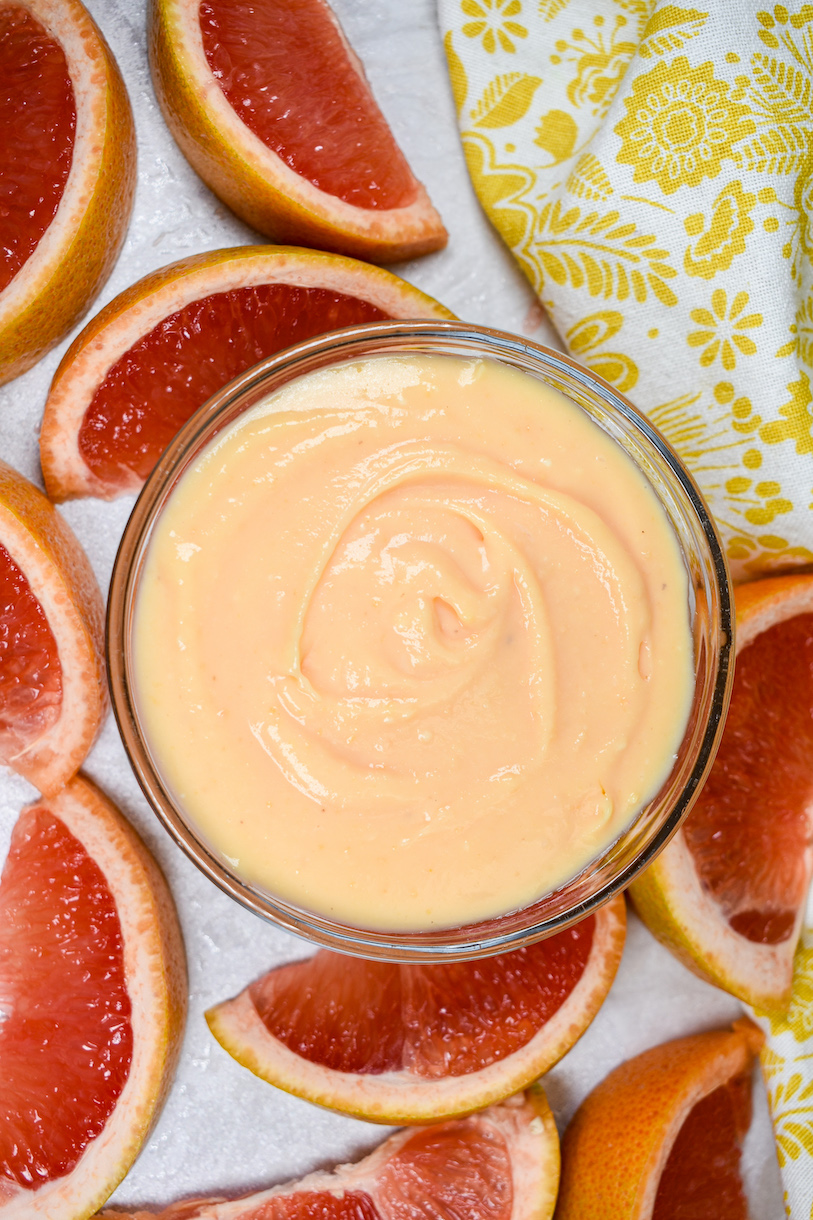 a dish of grapefruit curd surrounded by grapefruit slices