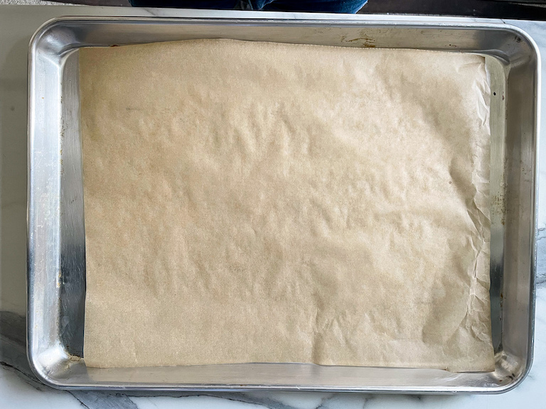 Tray lined with baking parchment
