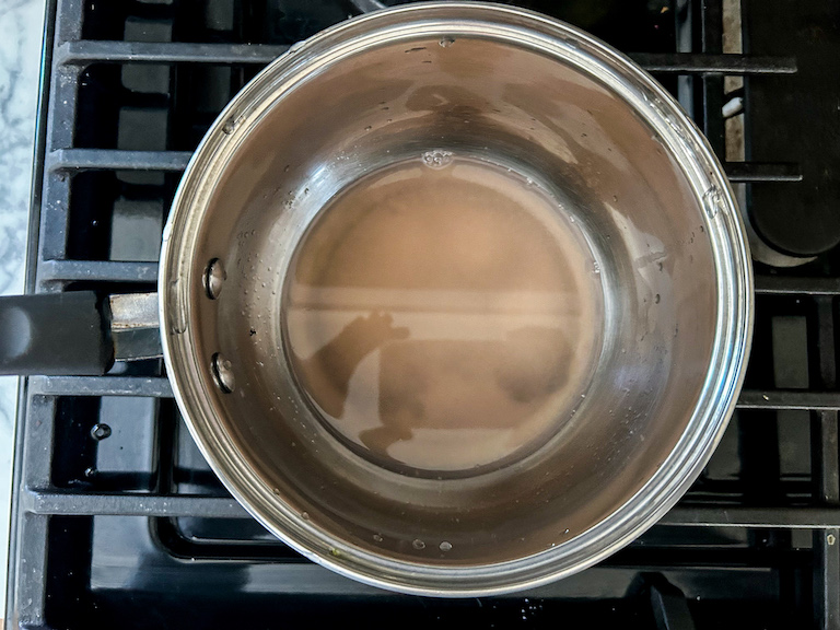 A saucepan of grapefruit juice