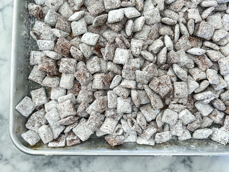 Homemade puppy chow cooling on a tray