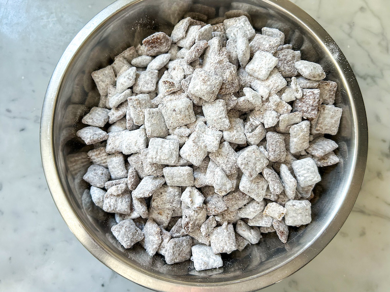 A bowl of homemade puppy chow snack mix