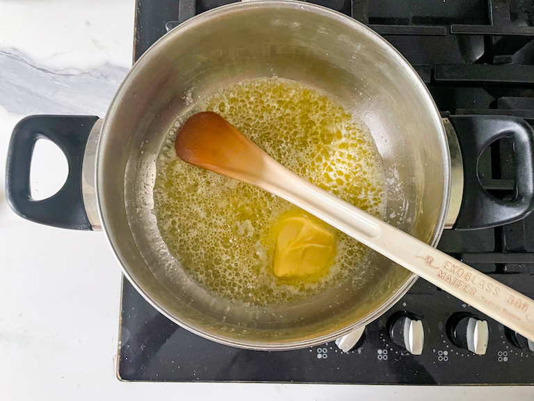 Butter melting in a stock pot on the stovetop
