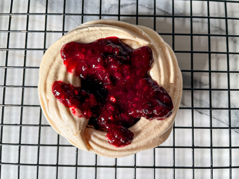 A meringue nest with berry compote