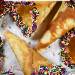 Homemade ice cream cone with rainbow sprinkles